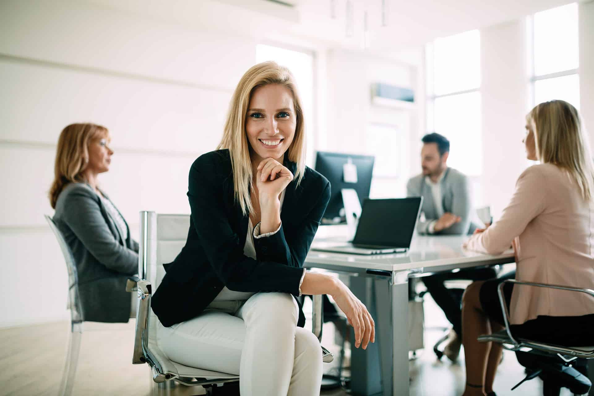 Picture of attractive smiling salesworkers on meeting in office